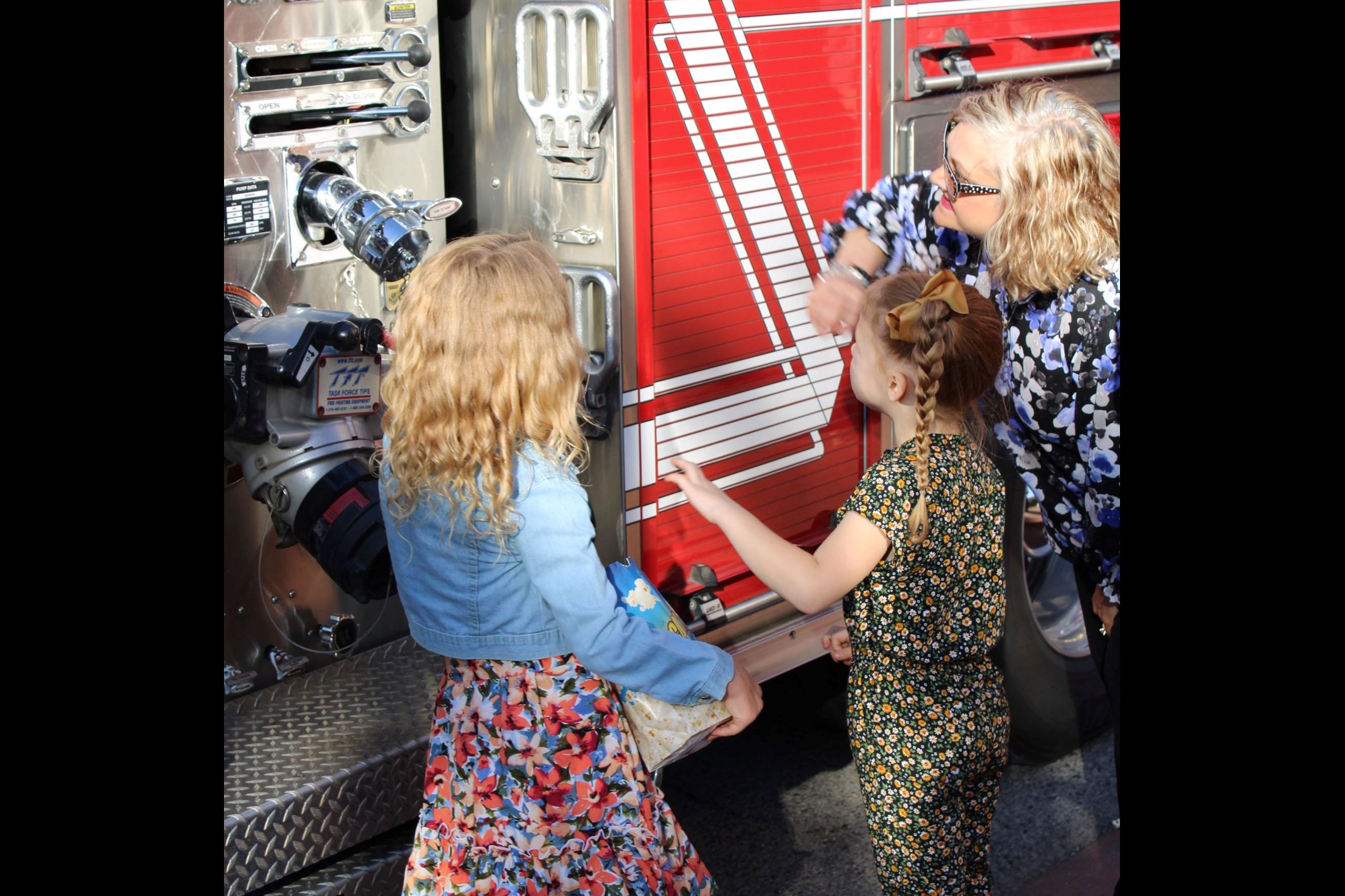 Extras checking out the fire engine