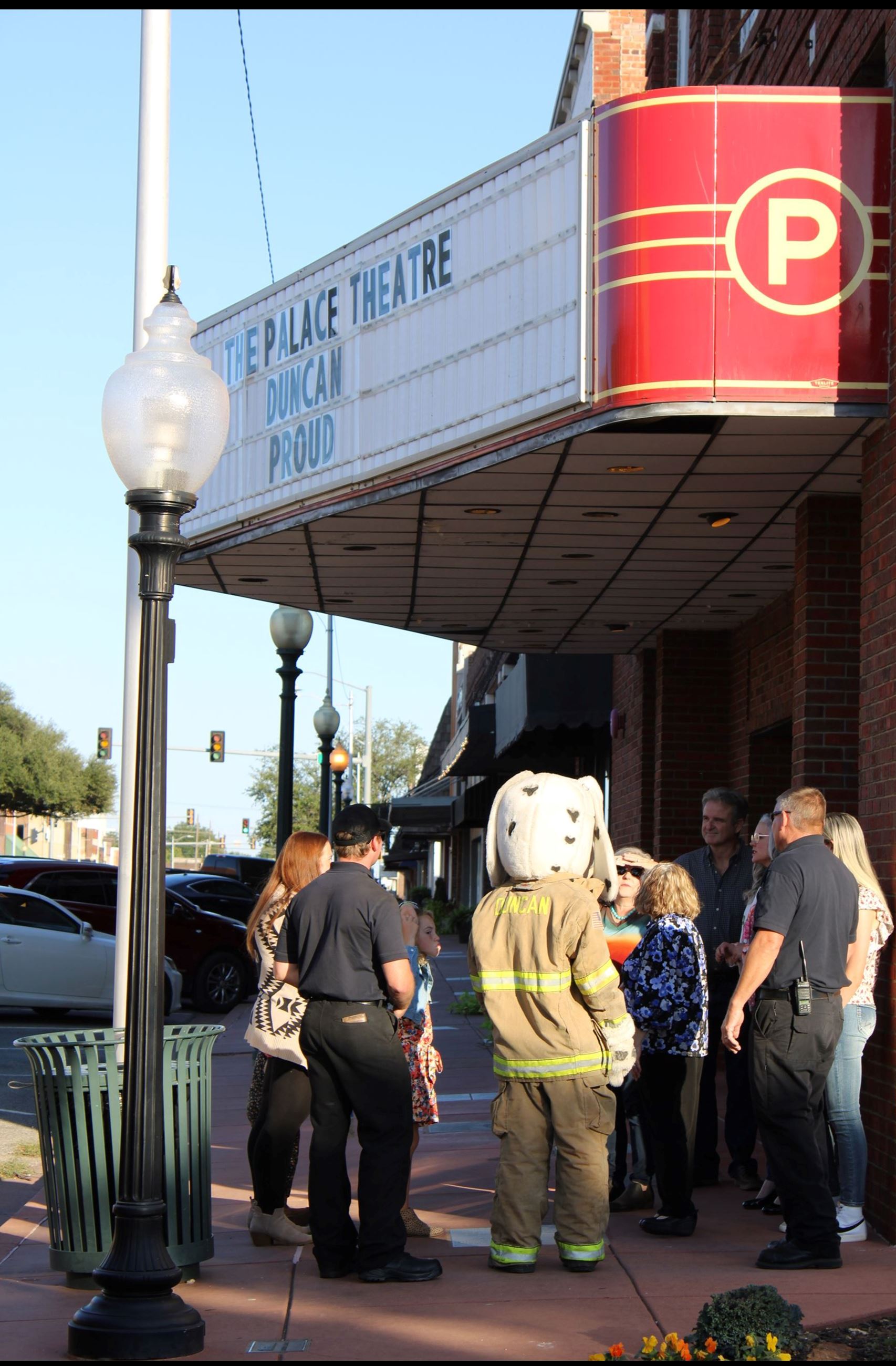 Extras and Sparky waiting for next take