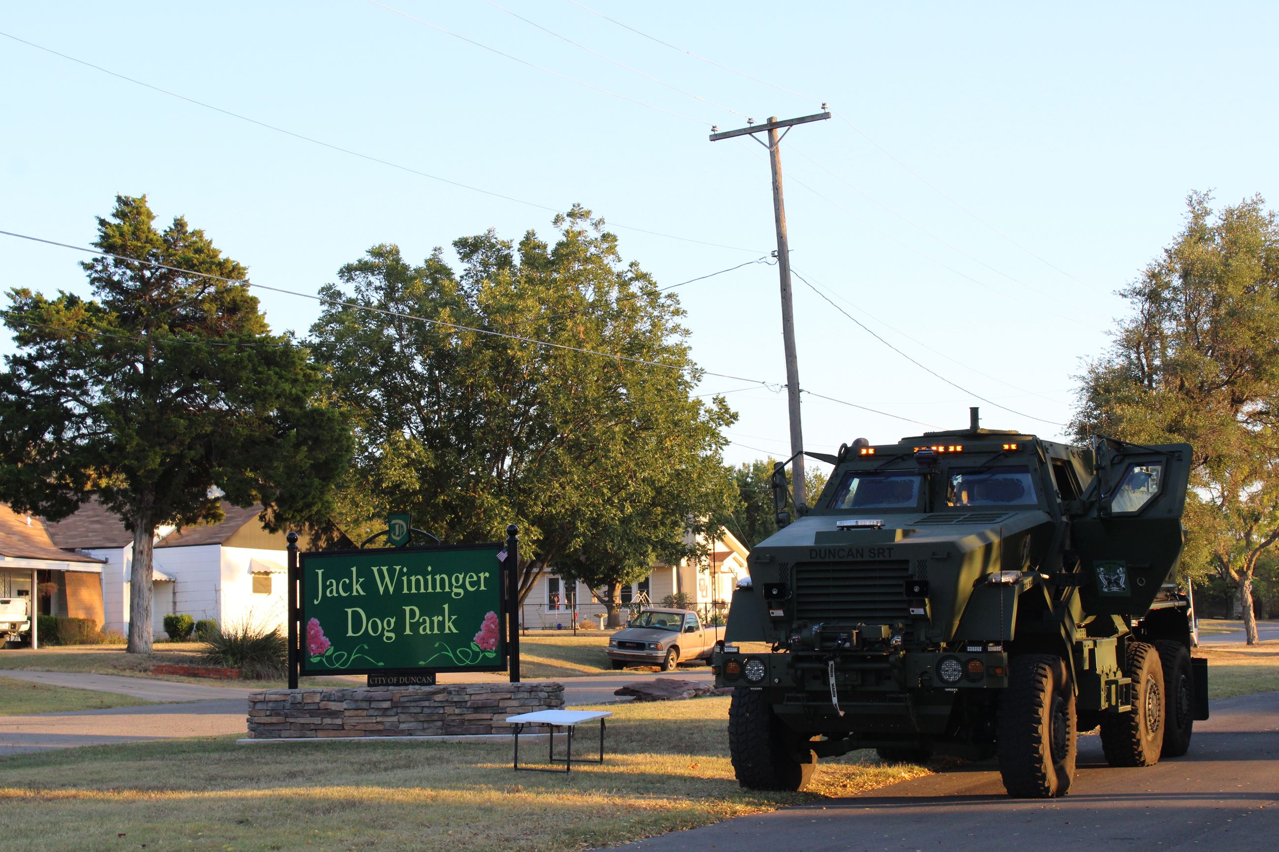 Duncan Police Department MRAP and Jack Wininger Dog Park sign